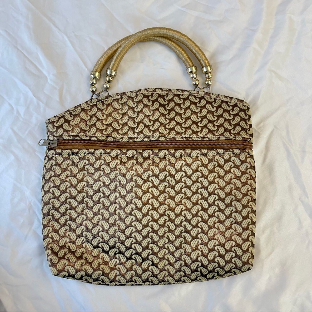 Vintage 90s golden paisley handbag with top handles. Good condition.